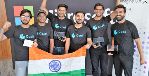A group of boys posing with the Indian flag