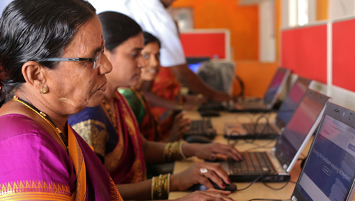 Women working at Digital Empowerment Centers for weavers