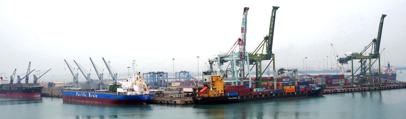 A port with ships and infrastructure required to transport containers