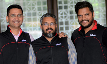 From left to right, Amod Malviya, Vaibhav Gupta and Sujeet Kumar, co-founders of Udaan, similing at the camera