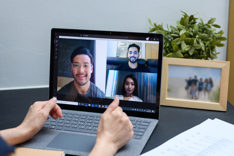 Four people connected over Microsoft Teams Call on a laptop