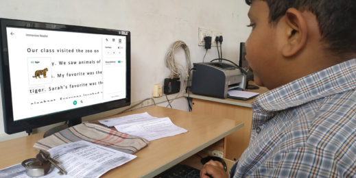 A primary student at Helikx Open school using pictorial dictionary feature of Immersive Reader to read a story.