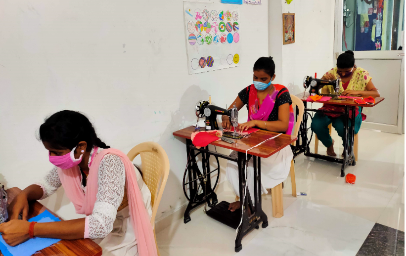 Women in rural India preparing masks amid the COVID-19 crisis.