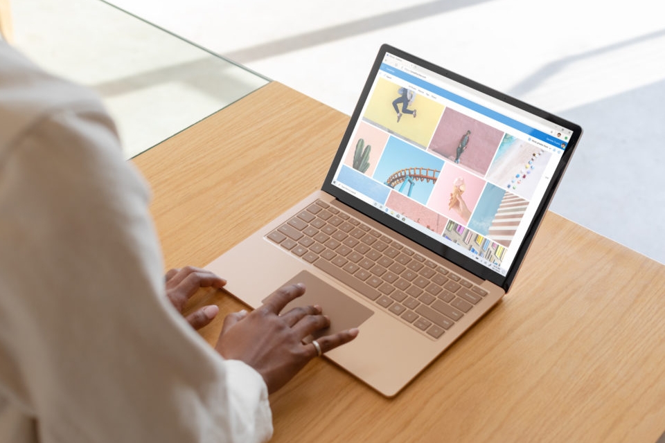 Stock photo of a person using the new Microsoft Surface Laptop Go