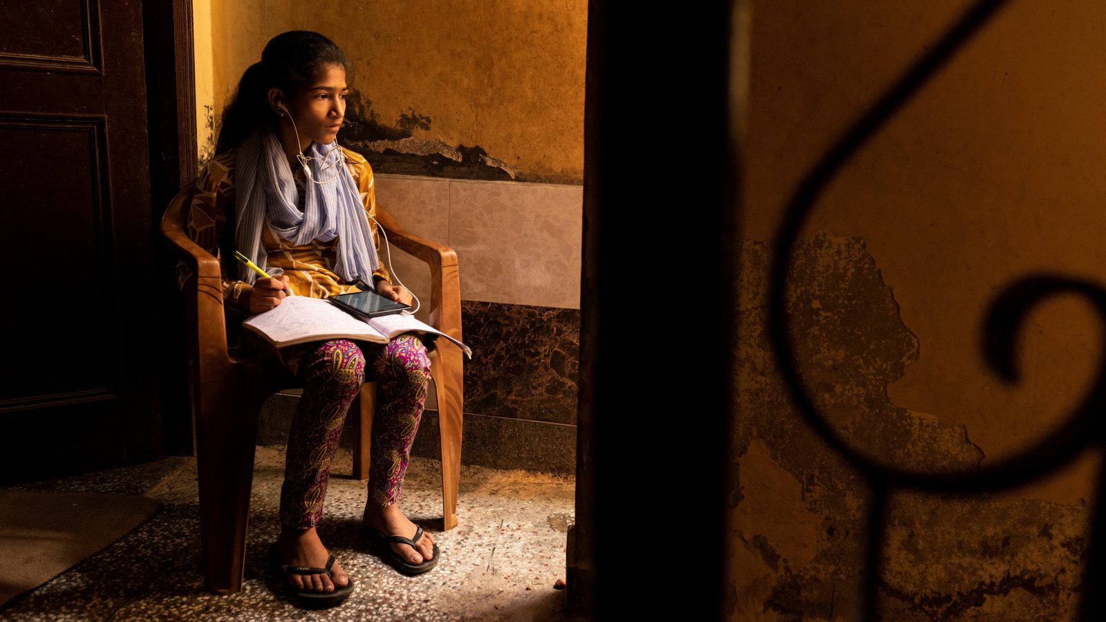 Photo of a girl studying via online classes at her home