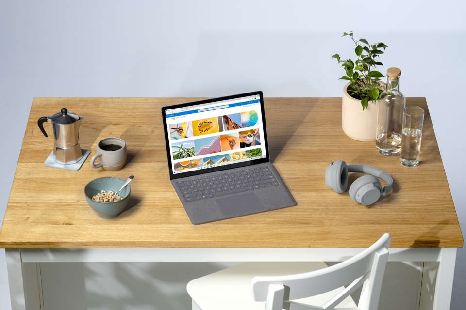 Photo of a work desk with the new Microsoft Surface Laptop 4 in the center