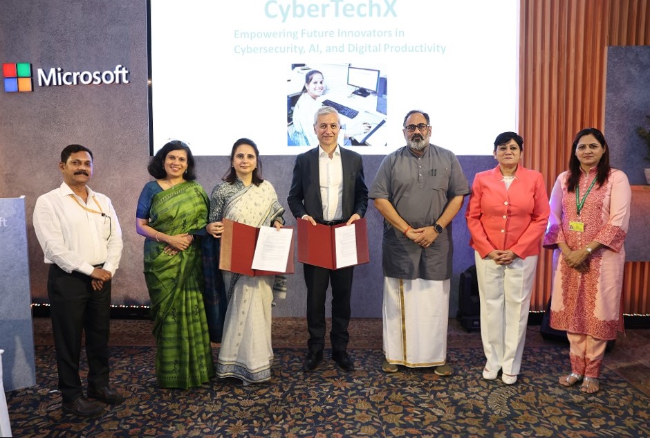 photohraph of Microsoft executives and ministers from MSDE at an MoU signing