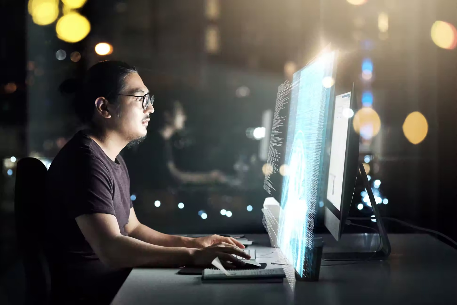 A man staring at a computer screen