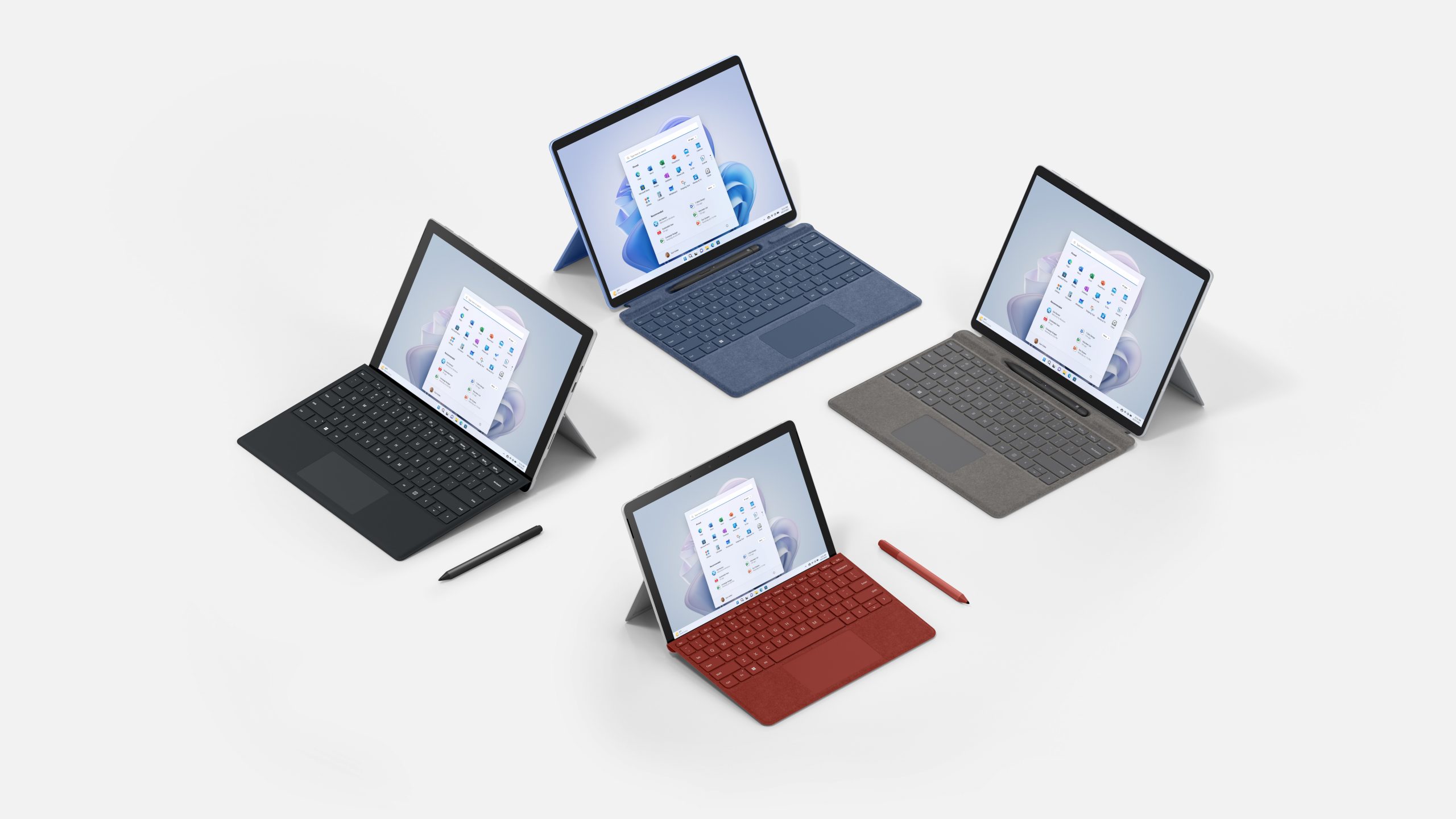 Feature render of Surface Pro 9, Surface Pro Signature Keyboard, Surface Slim Pen 2, Surface Pro 7+, Surface Pen, Surface Pro Type Cover, Surface Go 3, Surface Pen, Surface Go. Type Cover colors are Poppy, Graphite and Sapphire