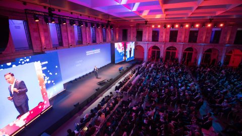 Upper view of a seated crowd watching keynotes during Building the future event, held in Lisbon