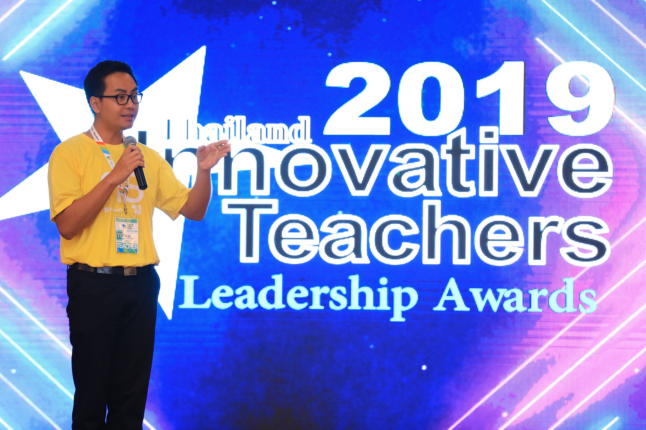 Man in front of Innovative Teachers 2019 logo on screen