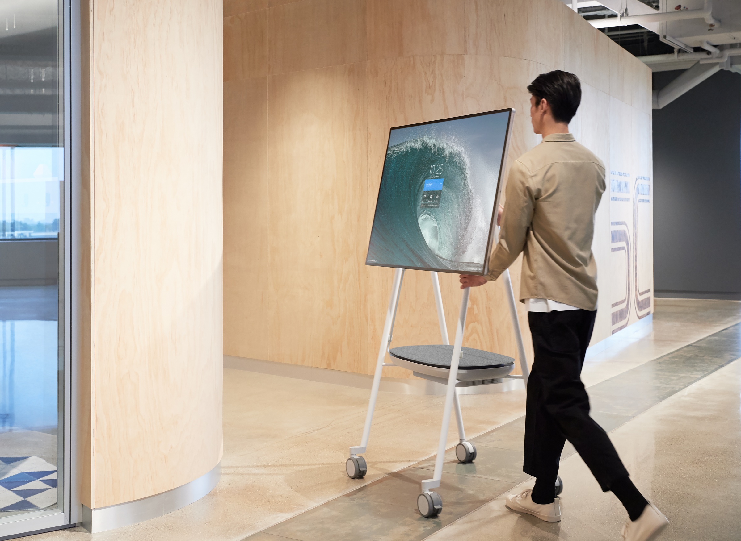 Surface Hub 2S on stand being moved