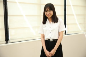 Young woman in Thai university student uniform