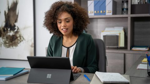 woman working on surface laptop
