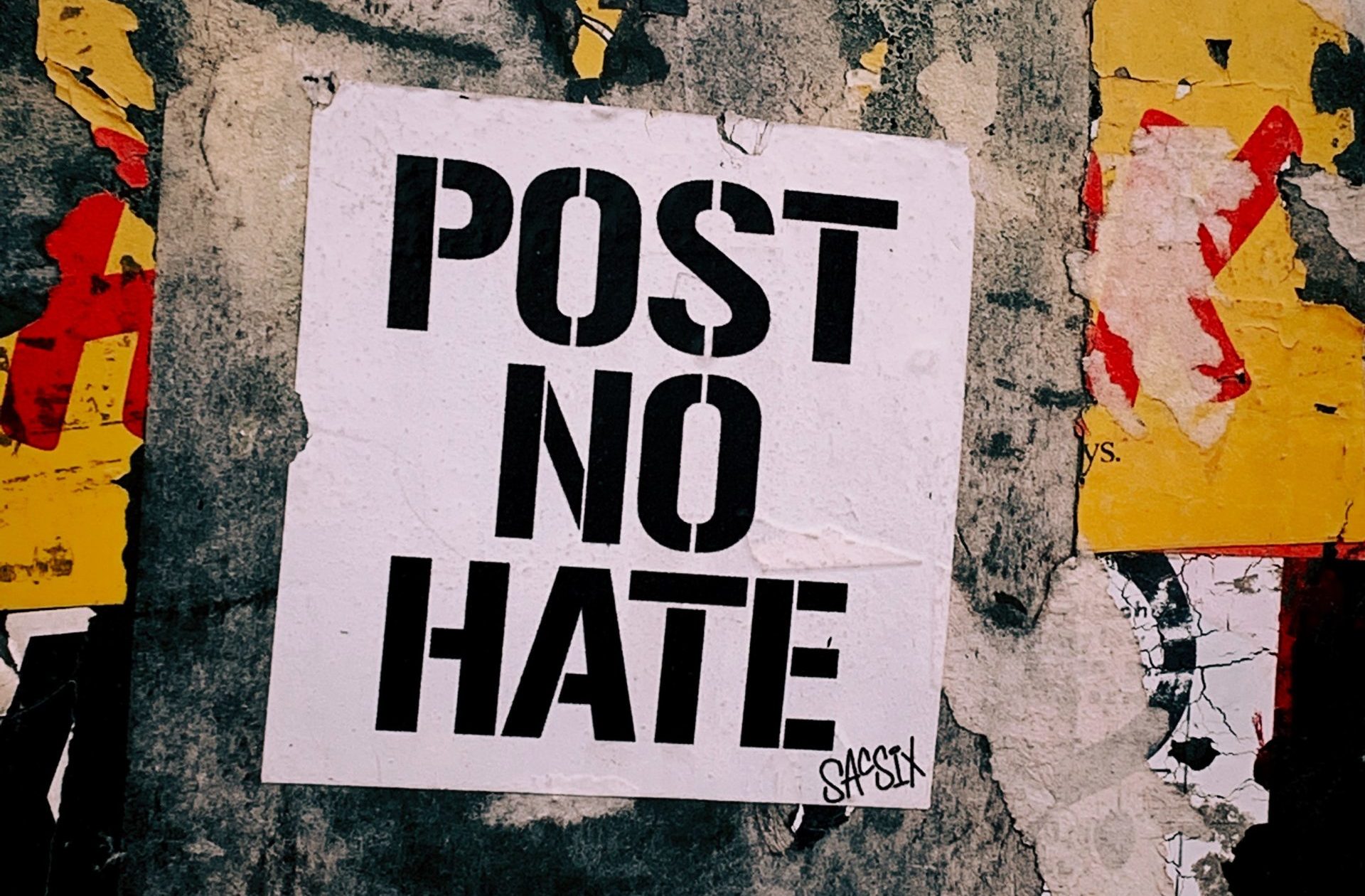 Post no Hate written on a street wall