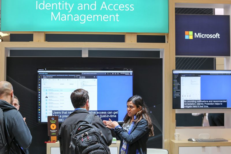 A Microsoft spokesperson speaks to attendees at the Microsoft booth at RSA on April 17, 2018.