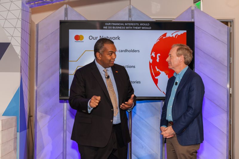 Mastercard’s Ron Green (left), and Microsoft’s Brad Smith, speak together during Microsoft’s security news briefing on April 16, 2018.