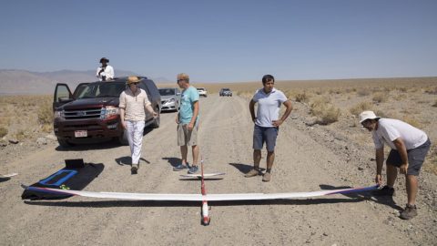 Debadeepta Dey, Andrey Kolobov, Rick Rogahn, Ashish Kapoor and Jim Piavis prepare to launch a type of glider known as a sailplane in the desert in Hawthorne, Nevada.