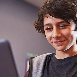 Boy looking at a laptop screen