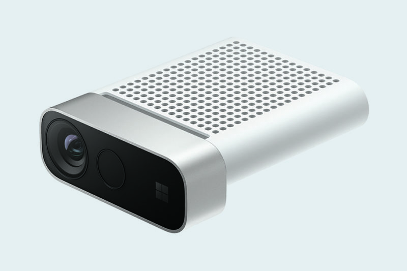 A close-up view of a compact silver Azure Kinect DK