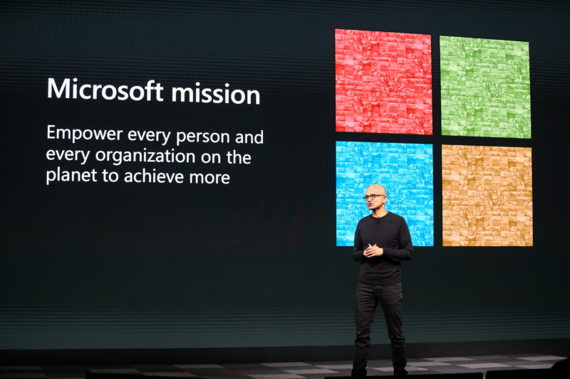 Microsoft CEO Satya Nadella stands on a stage during the MWC Barcelona event