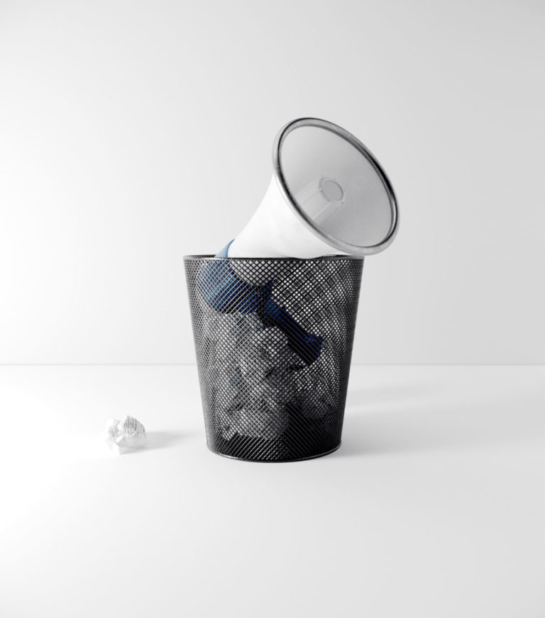 Wastebasket with megaphone in it