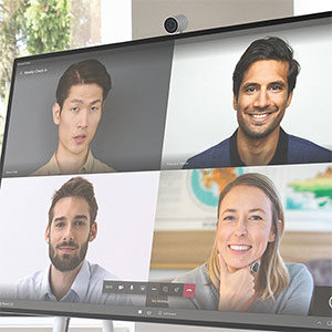 Computer screen showing four people on a video call