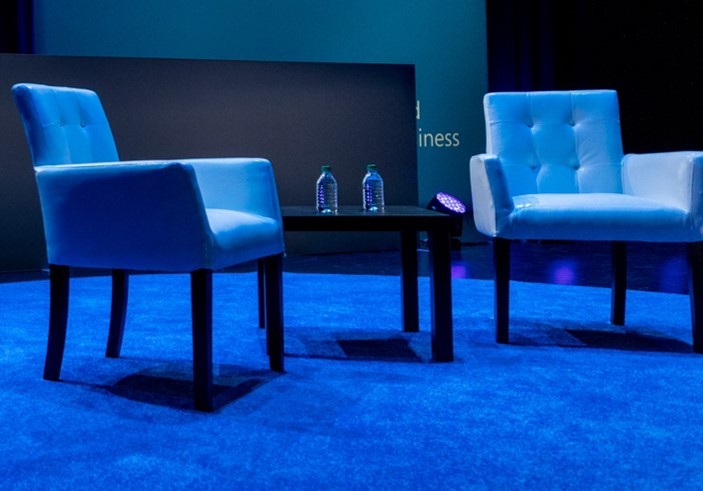 two blue chairs on a blue stage