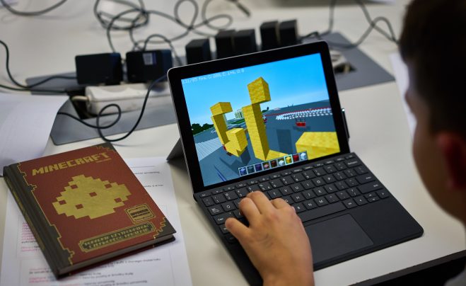 Laptop Surface Go with Minecraft game on the screen