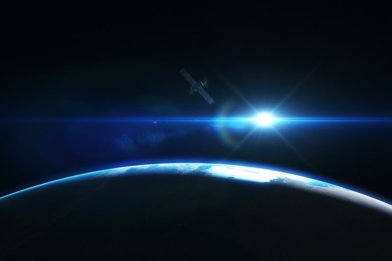 Earth with a light shining above it
