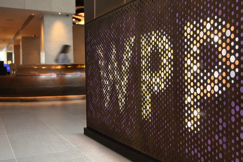 The lobby of an office building with a wall that says WPP in lights