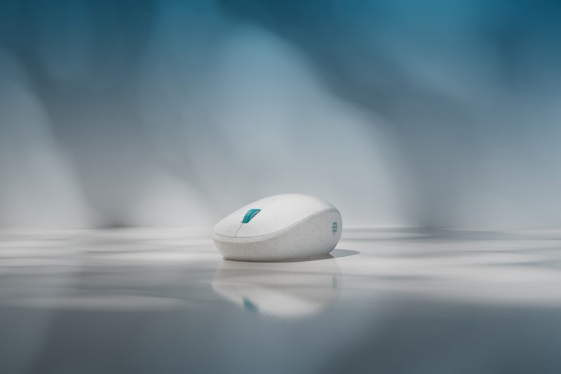 Ocean Plastic Mouse sitting on a reflective table