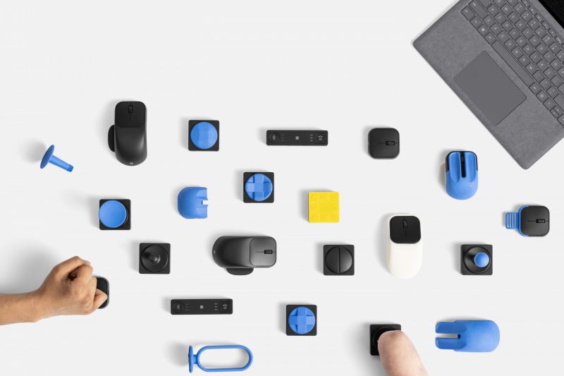 Several new Microsoft adaptive accessories, with two being used by someone