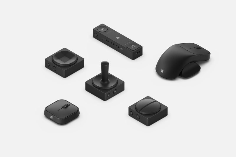 A series of mice, switches and a joystick are arranged next to each other.