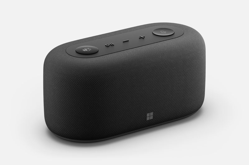 A speaker has five input buttons on the top to control sound settings.