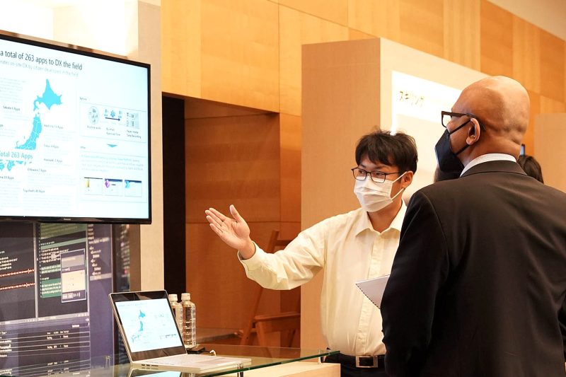 Microsoft Chairman and CEO Satya Nadella with a Japanese developer.