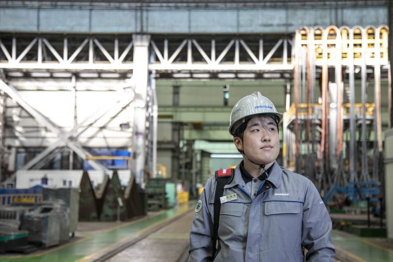 Wontaek Lee stands in the factory at Doosan Enerbility. Photo by Jean Chung for Microsoft. 