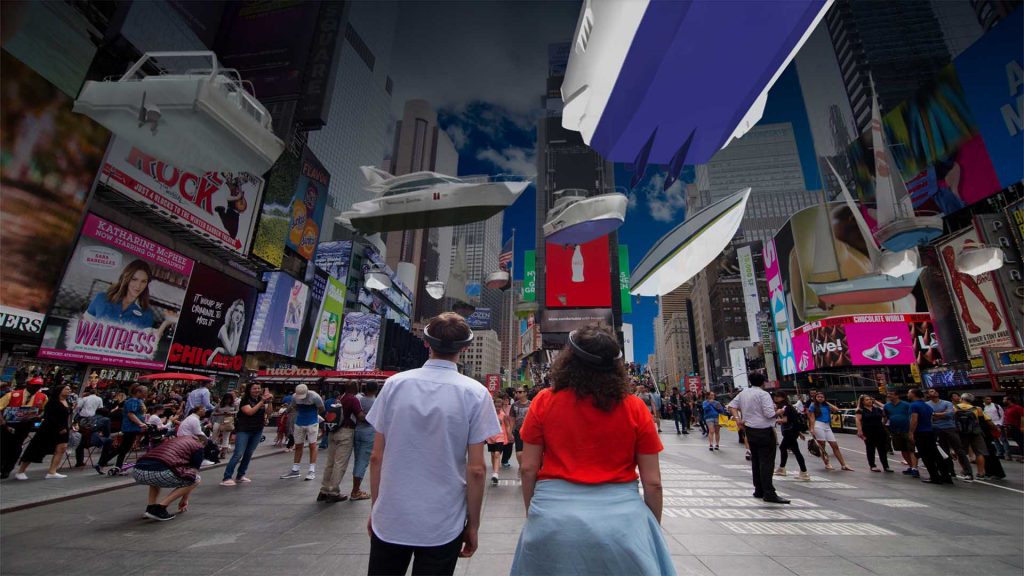 Two people in Times Square look at billboards using HoloLens