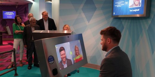 Guests at the newly opened National Comedy Center in Jamestown, New York, try to make each other crack a smile in the Laugh Battle exhibit. Microsoft AI is the behind-the-scenes judge of whether a player’s joke gets a laugh. Photo by Jean Coleman.