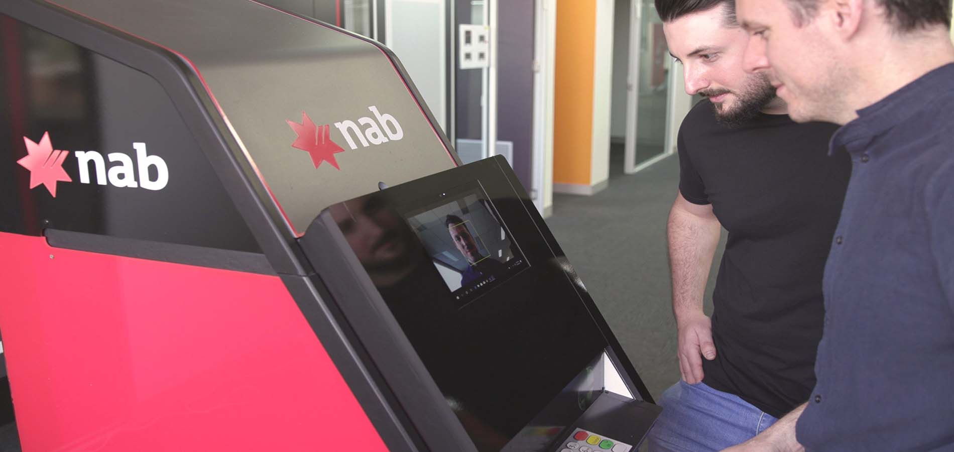 two men using a NAB ATM