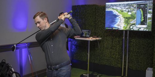 Coleman McDowell, marketing manager for Arccos Golf, demonstrates the Arccos Caddie at a Conversations in AI event in San Francisco. Photo by John Brecher for Microsoft.
