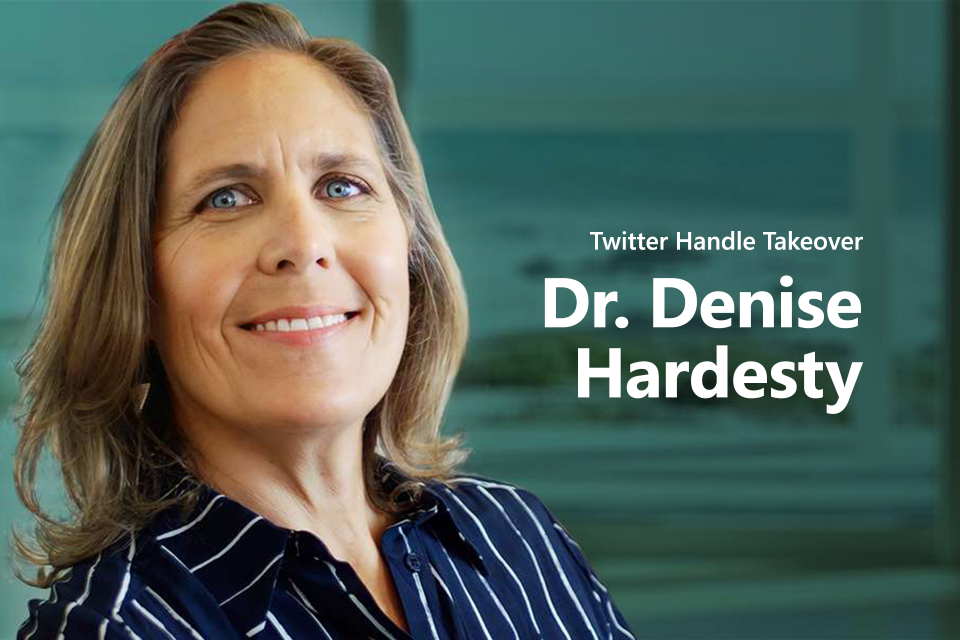 Image of Dr Denise infront of teal background