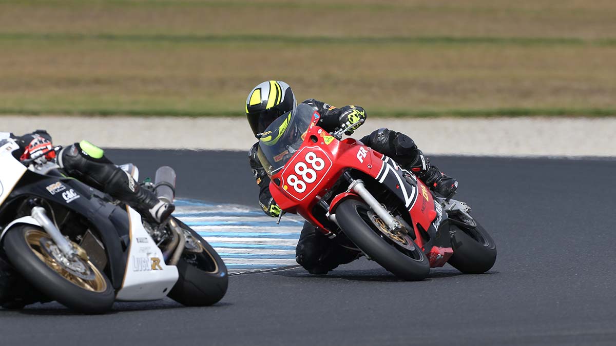 Two motorcyclists on a racing track
