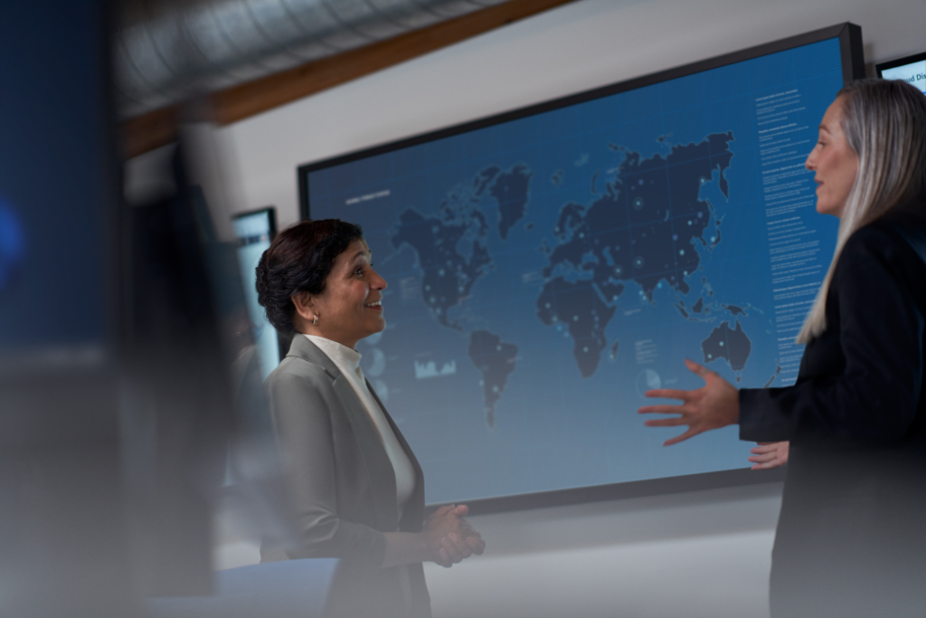 CISO (chief information security officer) collaborating with a practitioner in a security operations center