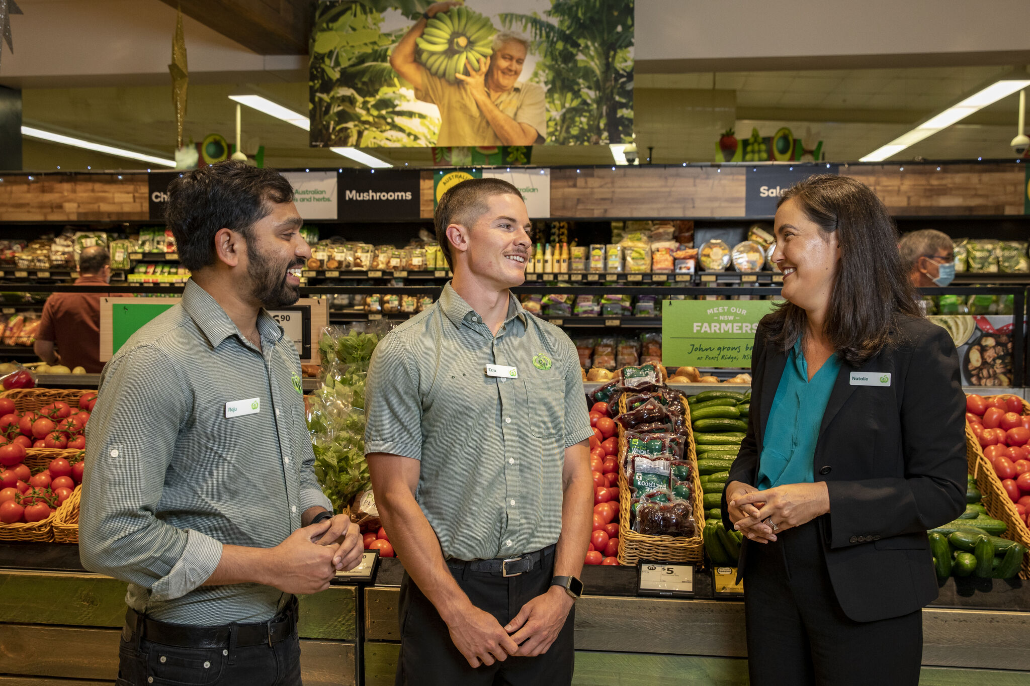 Two males and a female supermarket employees