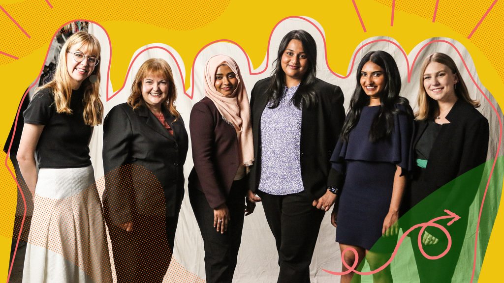 Seven adult females standing infront of a graphical background