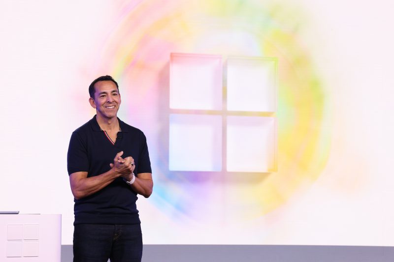 Image of Yusuf Mehdi, Microsoft corporate vice president and consumer chief marketing officer, speaking on stage.