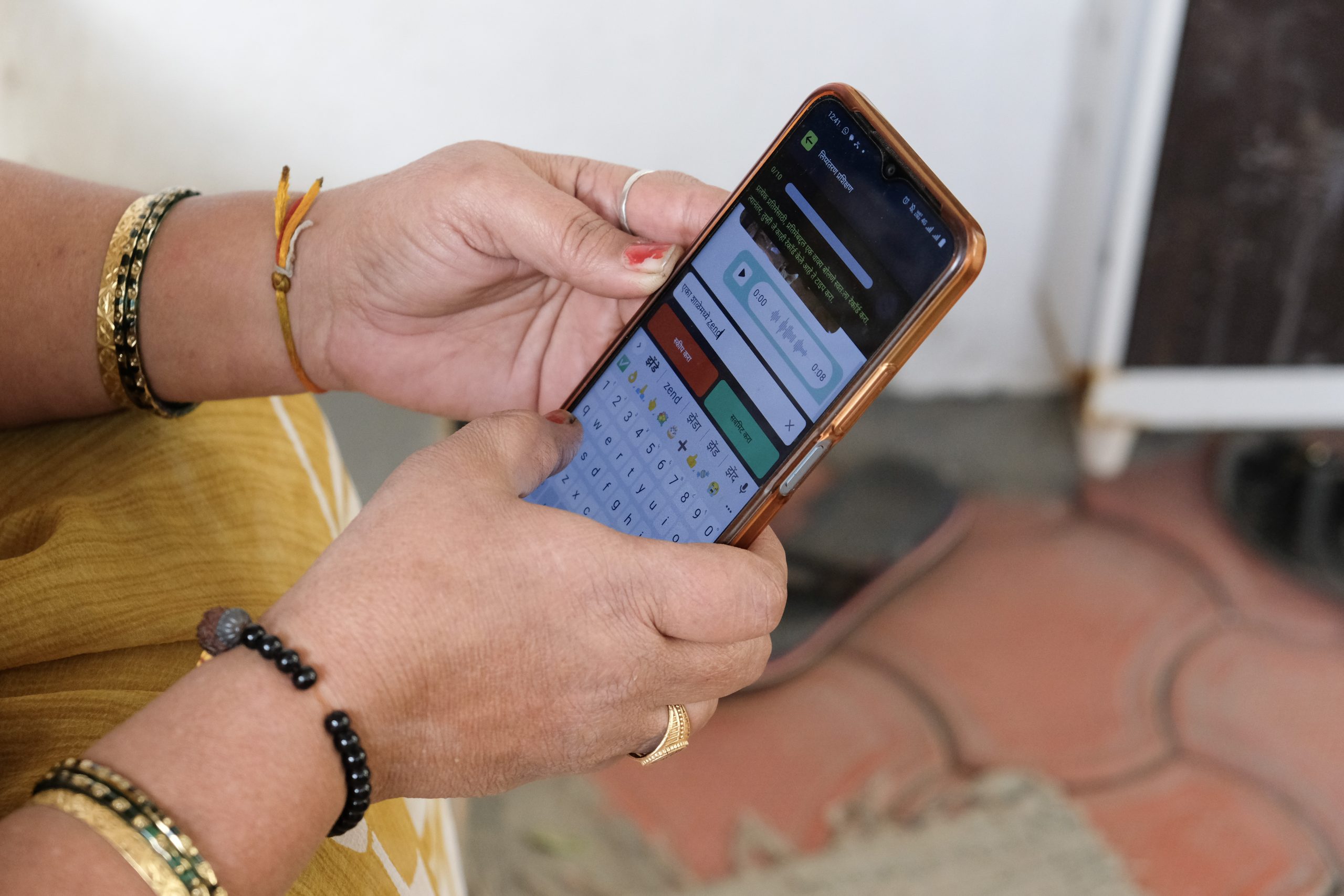 A woman’s hands holding a smartphone