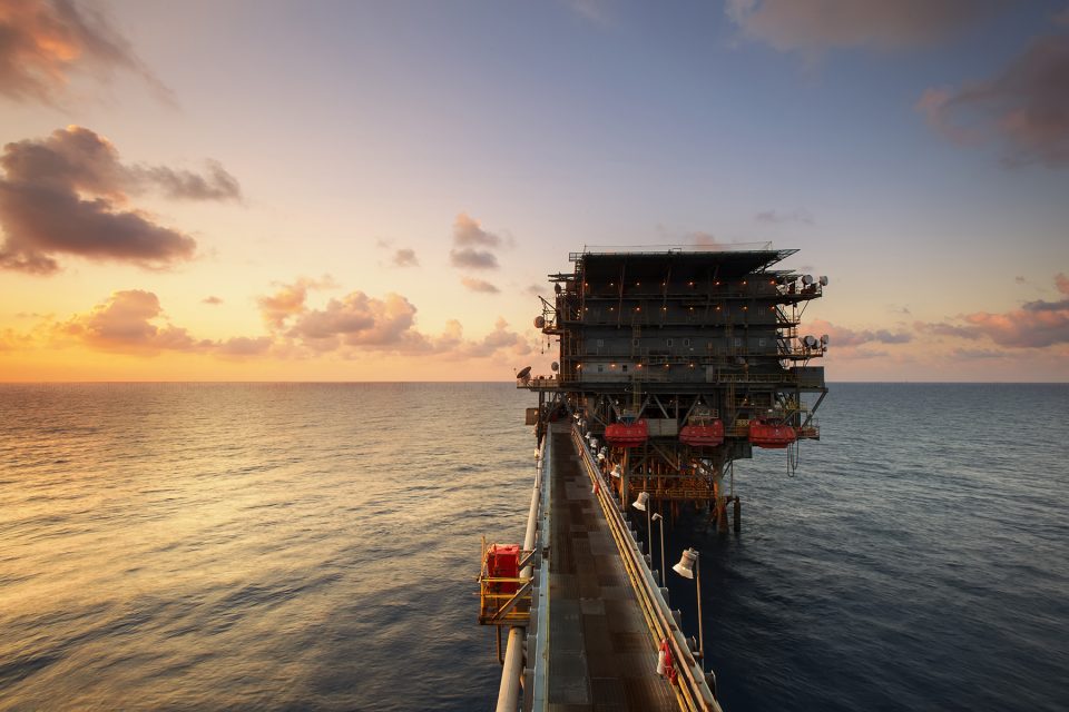 oil rig in sea at dusk