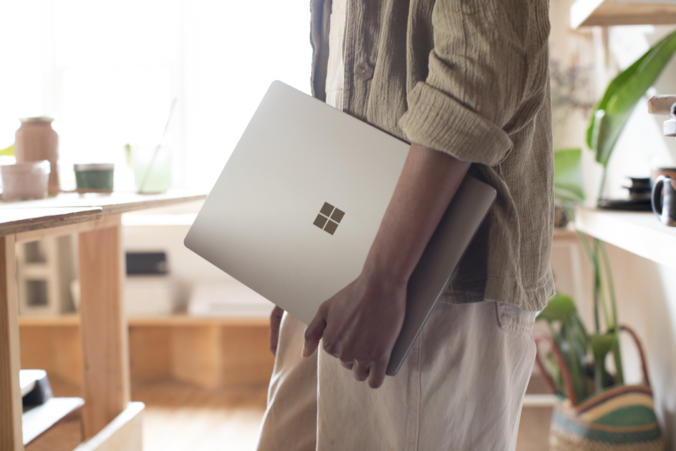 Man holding Surface Book